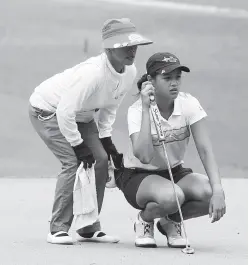  ??  ?? AREVALO and caddie