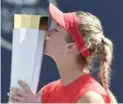  ?? NATHAN DENETTE/THE CANADIAN PRESS ?? After three wins in about 24 hours, Elina Svitolina “couldn’t believe that it’s all finished and I’m holding the trophy.”