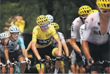  ?? Chris Graythen Getty Images ?? TOUR DE FRANCE leader Christophe­r Froome, center, and his top rivals took it fairly easy during Stage 19.