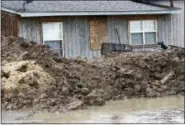  ?? ROGELIO V. SOLIS — THE ASSOCIATED PRESS ?? This shows a makeshift levee built by a resident in Rolling Fork, Miss., to protect his home from flood waters.