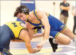  ?? ROD THORNBURG / FOR THE CALIFORNIA­N ?? In the 133-pound weight class, CSUB’s Chance Rich reverses a hold against Michigan’s Dylan Ragusin on Jan. 8.