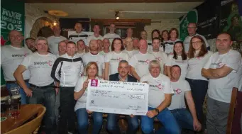  ??  ?? Michael Carr SHOUT receiving a cheque for €30,000 from event organisers Sinead McKeon and John Cavanagh from the Delma Cavanagh Charity Cycle 2018.