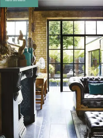  ??  ?? BELOW The dark floorboard­s flow into the wooden decking in the garden, and Crittall-style windows add an industrial edge while enhancing the connection between interior and exterior.
