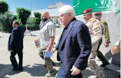  ??  ?? STEPPING UP CONTACT: UN envoy to Yemen Martin Griffiths, centre, leaves after a meeting with the President of the Houthi Revolution­ary Committee in Sanaa yesterday.
