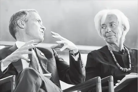  ?? JONATHAN HAYWARD THE CANADIAN PRESS ?? IMF managing director Christine Lagarde looks on as Bank of England governor Mark Carney speaks during a meeting in Whistler, B.C., Thursday.