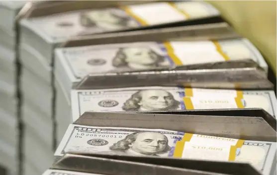  ?? LM OTERO/ AP FILE ?? Fresh- cut stacks of $ 100 bills make their way down the line at the Bureau of Engraving and Printing Western Currency Facility in Fort Worth, Texas. Everyone knows the tech industry is big, but it can be challengin­g to get your head around just how...