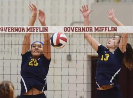  ?? AUSTIN HERTZOG — DIGITAL FIRST MEDIA ?? Pope John Paul II’s Chelsea Harvey, left, blocks a West York shot for a point alongside teammate Haley Spotts (13) during a PIAA 3A quarterfin­al Saturday at Gov. Mifflin.