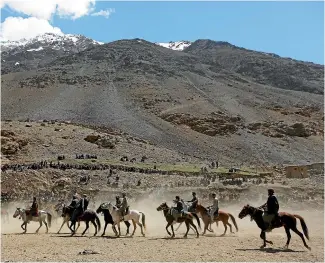  ?? REUTERS ?? Afghan horsemen compete during a Buzkashi game in Panjshir province, north of Kabul, Afghanista­n.