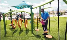  ?? ADOLPHE PIERRE-LOUIS/JOURNAL ?? City officials, community members and dignitarie­s held a ribboncutt­ing ceremony in May to formally celebrate the opening of A Park Above in Rio Rancho, the state’s first fully inclusive playground.