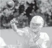  ?? MIKE STOCKER/SUN SENTINEL ?? Dolphins quarterbac­k Brock Osweiler throws the ball during practice in Davie.