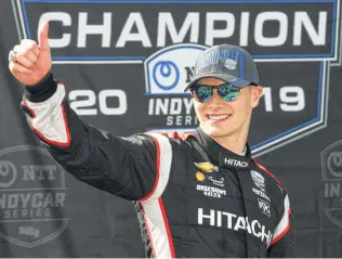  ?? Robert Reiners / Getty Images ?? Josef Newgarden was all smiles in victory lane after finishing eighth in Sunday’s IndyCar race at Monterey, Calif., and winning his second series championsh­ip in three years.