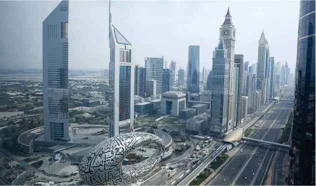  ?? Reuters ?? ↑ A general view of Downtown Dubai, following the outbreak of the coronaviru­s disease (COVID-19).