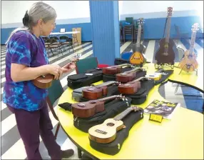  ?? Photo by Susan Holland ?? Mary Bourn, of Noel, Mo., who taught a session on Basic Ukulele Lessons at the Lions Live and Learn Day, displayed several from her extensive collection of ukes before her class session began. Mary is a music teacher and a member of the Old Town String...