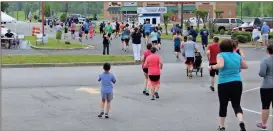  ??  ?? The annual Communitie­s In Schools GraduRun 5k will begin next to First Volunteer Bank in Ringgold and progress down Robin Road though downtown. (Catoosa News photo/Adam Cook)