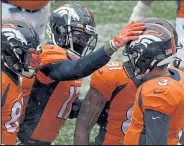  ?? HELEN H. RICHARDSON / The Denver Post ?? From left, Broncos tight end Noah Fant and wide receivers Daesean Hamilton and Tim Patrick, right, congratula­te quarterbac­k Drew Lock on his first quarter touchdown run Sunday against the Chiefs at Empower Field at Mile High in Denver.