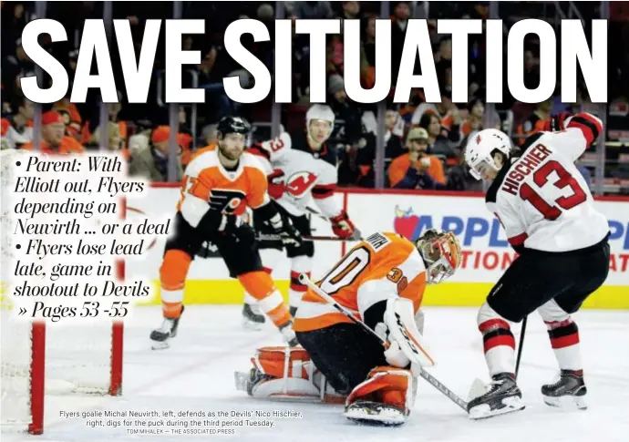  ?? TOM MIHALEK — THE ASSOCIATED PRESS ?? Flyers goalie Michal Neuvirth, left, defends as the Devils’ Nico Hischier, right, digs for the puck during the third period Tuesday.