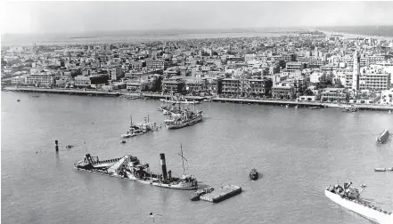  ?? AP ?? In this 1956 file photo, scuttled ships lay at the entrance to the Suez Canal, at Port Said.