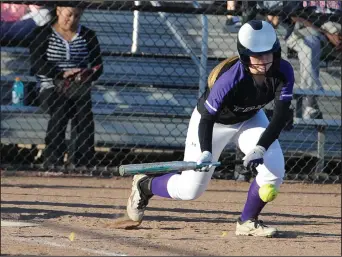  ?? BEA AHBECK/NEWS-SENTINEL ?? Tokay's Brooke Graddy bunts the ball during their game against Napa in Stockton on March 10.