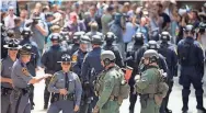  ?? TASOS KATOPODIS/EPA ?? Virginia State Police keep crowds back Aug. 13 after “Unite the Right” organizer Jason Kessler spoke at City Hall in Charlottes­ville, Va.