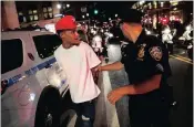  ??  ?? Ramsey Orta is detained during a march in Manhattan against the Charlotte police shooting of Keith Scott yesterday.