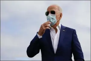  ?? The Associated Press ?? CAMPAIGN PLANE: Democratic presidenti­al candidate former Vice President Joe Biden speaks to members of the media before boarding his campaign plane at New Castle Airport, in New Castle, Del., Tuesday, en route to Florida.