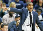  ?? MICHAEL DWYER - THE ASSOCIATED PRESS ?? UConn head coach Kevin Ollie reacts during the first half of an NCAA college basketball game against Cincinnati Sunday in Storrs, Conn.