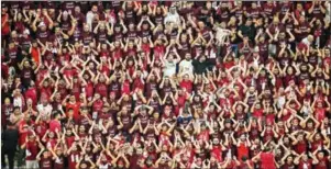  ?? (AFP) ?? Qatar’s fans cheer during the Qatar 2022 World Cup Group A football match between Qatar and Ecuador at the Al-Bayt Stadium in Al Khor, north of Doha on Sunday last.