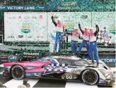  ?? JOHN RAOUX/AP ?? Drivers, from left, Tom Blomqvist, Colin Braun, Helio Castroneve­s and Simon Pagenaud celebrate Sunday after winning the Rolex 24 at Daytona.