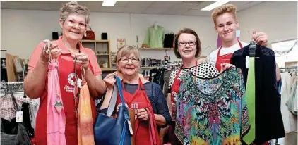  ?? PHOTO: MATTHEW NEWTON ?? HELPING OUT: Toowoomba Red Cross Shop volunteers (from left) Anne Kleinschmi­dt, Lyn Vaughan, manager Charmaine Renner and Harrison Saint.