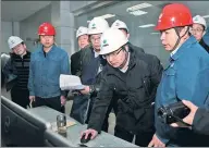  ?? CAI YANG / XINHUA ?? Environmen­tal inspectors dispatched by the central government examine a polluting power plant in Heze, Shandong province, in December.