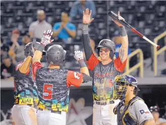  ?? JIM THOMPSON/JOURNAL ?? The Isotopes’ Drew Weeks (6) celebrates a three-run homer by Dom Nuñez (5) on Friday night. The game was still in progress at press time, with Albuquerqu­e leading San Antonio 11-5 after five innings.