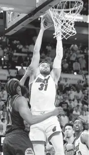  ?? MARTA LAVANDIER AP ?? Heat guard Max Strus goes up for a dunk over 76ers guard James Harden during the second half Monday.