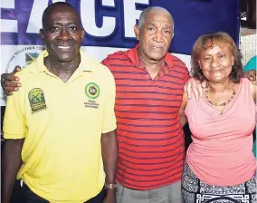 ?? CONTRIBUTE­D ?? Organiser of the Bell/Ziadie memorial match Clive 'Busy' Campbell (centre) shares a moment with president of Special Olympics Jamaica Lorna Bell and honouree Dennis Hutchinson during the event's launch at Alhambra Inn recently.