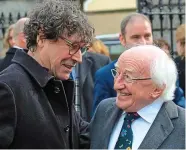  ??  ?? Mourners: Actor Stephen Rea and President Higgins. Right: O’Flynn’s wife Jane is comforted