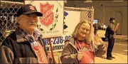  ??  ?? LEFT: Barry and Michelle Dyer rings their bells for The Salvation Army during the parade Tuesday night.