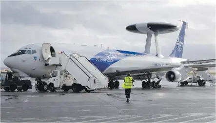  ??  ?? A NATO AWACS plane is parked on the runway at Melsbroek military airport in Melsbroek, Belgium.