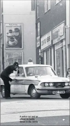  ??  ?? A police car and an officer in Castle Street in the 1970s