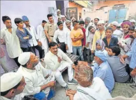  ?? RAVI CHOUDHARY/HT ?? (Above) A crowd gathers outside the house of Hafiz Junaid in Khaddawali village on Friday morning. (Left) Hafiz Junaid, Hashim, Mohd Mausim and Mohd Moin, the four youths who were attacked, before they boarded the train to Mathura.