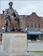  ??  ?? A statue of Abraham Lincoln greets visitors in front of the Lincoln Museum in Hodgenvill­e, Ky.