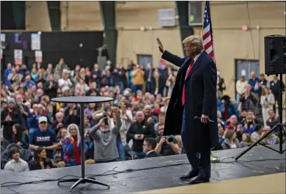  ?? DOUG MILLS — THE NEW YORK TIMES ?? Former President Donald Trump visits a caucus site at the Horizon Event Center in Clive, Iowa, on Monday. Trump won the Iowa caucuses in what is called a crucial first step in his bid to reclaim the Republican nomination for the third consecutiv­e election.