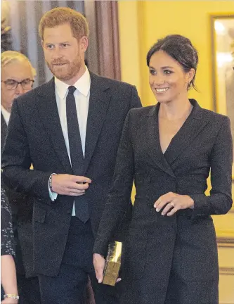  ?? WPA POOL GETTY IMAGES ?? This tuxedo dress caused the search term “Meghan Markle skinny legs” to spike on Google results. Prince Harry, Duke of Sussex and Meghan, Duchess of Sussex are shown attending a gala performanc­e of “Hamilton” on Aug. 29 in support of Sentebale at Victoria Palace Theatre in London.