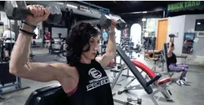  ?? MICHAEL SEARS / MILWAUKEE JOURNAL SENTINEL ?? Nicole Goodno, left, of Franklin and Kristen Kalenowicz of Milwaukee work out Monday at the Brickyard Gym, 2651 S. Kinnickinn­ic Ave., in Milwaukee. They both compete in the Figure and Fit Body competitio­n.