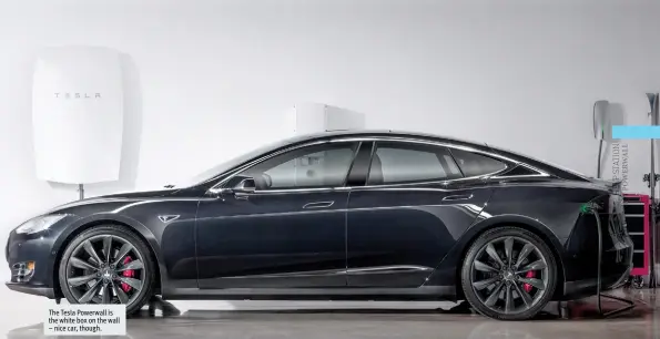  ??  ?? The Tesla Powerwall is the white box on the wall – nice car, though.