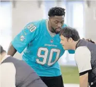  ?? MICHAEL LAUGHLIN/STAFF PHOTOGRAPH­ER ?? Miami Dolphins rookie Charles Harris instructs his players as the Dolphins hosted Special Olympics Florida athletes in flag football games on Tuesday.