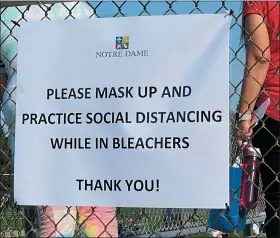  ?? STEPHEN FRYE— MEDIANEWS GROUP ?? Pictured is a sign requiring masks at an Oakland County prep sports field.