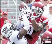  ?? Arkansas Democrat-Gazette/MITCHELL PE MASILUN ?? Fifth-year senior Santos Ramirez (right) is a returning starter for Arkansas at safety. Last season, he had 63 tackles, 3 forced fumbles and 1 intercepti­on.