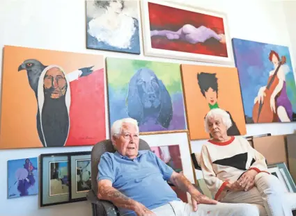  ?? PHOTOS BY DOUG HOKE/THE OKLAHOMAN ?? Renowned Oklahoma City artist Bert Seabourn sits with his wife of 71 years, Bonnie, in his studio in his home on Aug. 23.