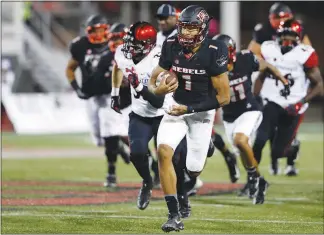  ?? STEVE MARCUS (2017) ?? UNLV quarterbac­k Armani Rogers (1) is heading into his second season as the Rebels’ starting quarterbac­k.