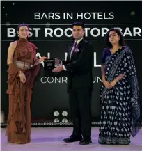  ?? ?? Puneet Gupta, sales manager, Conrad Pune receives the award for the Best Rooftop Bar in a hotel.