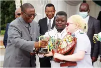  ?? — Picture: Joseph Manditswar­a. ?? Vice President and Health and Child Care Minister Dr Constantin­o Chiwenga hands over trophies and shields to Fortunate Nyahwema (right) and Enesia Vhareta Mawangu (centre) during the School of Nursing and Midwifery annual graduation and prizegivin­g ceremony at Sally Mugabe CentralHos­pital in Harare yesterday .